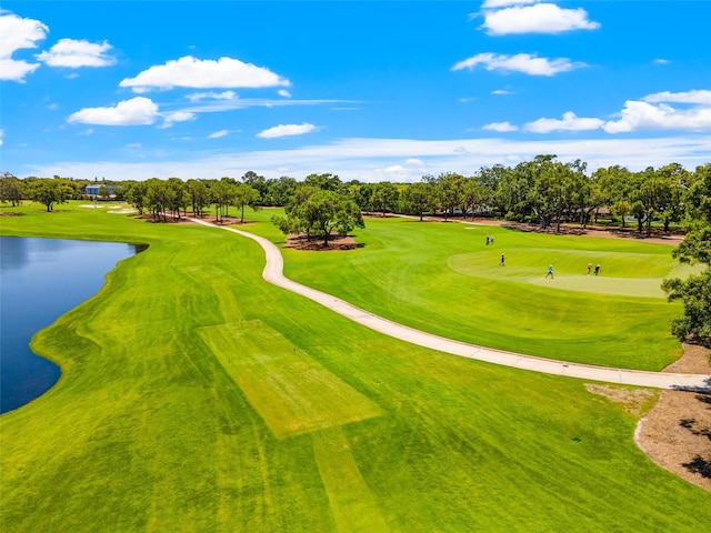 view of community with view of golf course and a water view