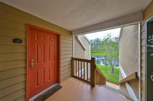 9481 Highland Oak Dr Unit 1206, Tampa, FL 33647 - property entrance featuring a porch and a water view