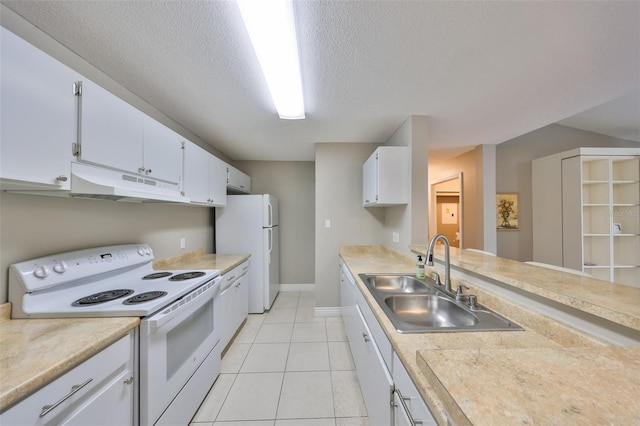 9481 Highland Oak Dr Unit 1206, Tampa, FL 33647 - kitchen featuring white appliances, under cabinet range hood, light countertops, white cabinetry, and a textured ceiling