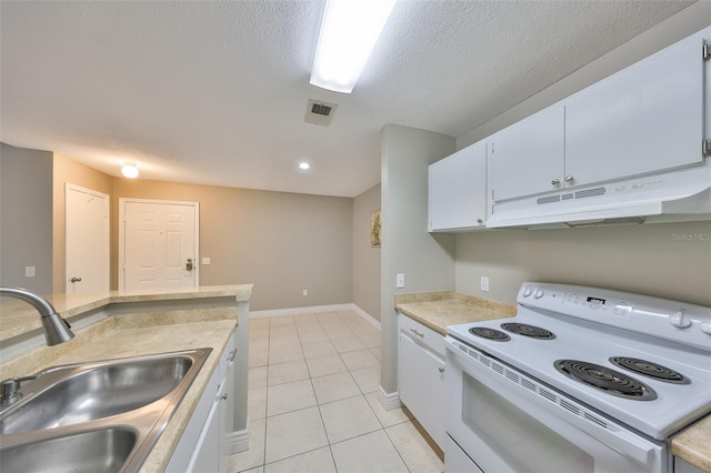 9481 Highland Oak Dr Unit 1206, Tampa, FL 33647 - kitchen with white electric range oven, under cabinet range hood, light countertops, white cabinets, and light tile patterned floors