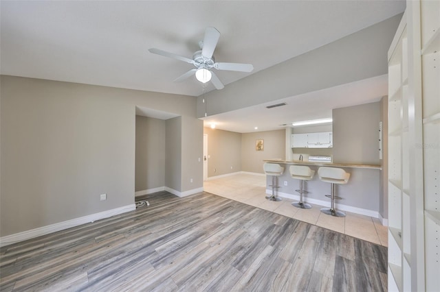 9481 Highland Oak Dr Unit 1206, Tampa, FL 33647 - unfurnished living room featuring wood finished floors and a ceiling fan