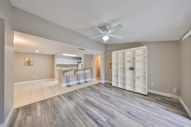 9481 Highland Oak Dr Unit 1206, Tampa, FL 33647 - unfurnished living room featuring ceiling fan and wood finished floors