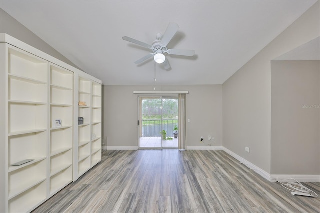 9481 Highland Oak Dr Unit 1206, Tampa, FL 33647 - unfurnished room with ceiling fan, light wood-style floors, and lofted ceiling