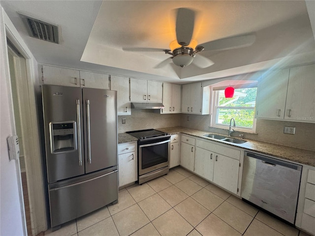 kitchen featuring a raised ceiling, visible vents, a sink, and appliances with stainless steel finishes
