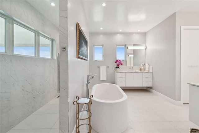 90 Martinique Ave, Tampa, FL 33606 - full bathroom with recessed lighting, marble finish floor, vanity, a marble finish shower, and a soaking tub