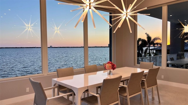 90 Martinique Ave, Tampa, FL 33606 - dining space with a chandelier, a water view, and baseboards