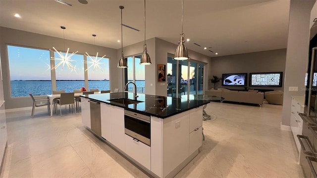90 Martinique Ave, Tampa, FL 33606 - kitchen featuring white cabinets, stainless steel dishwasher, a sink, dark countertops, and modern cabinets