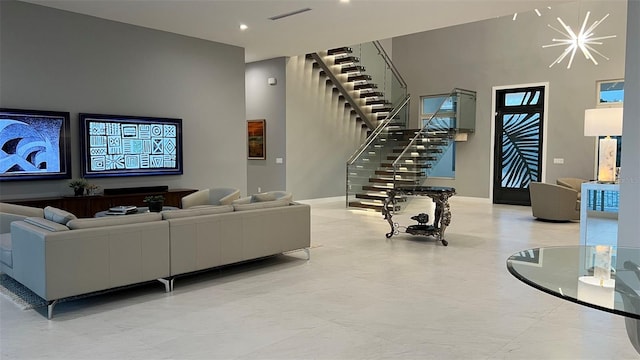 90 Martinique Ave, Tampa, FL 33606 - living room with a towering ceiling, stairs, visible vents, and baseboards