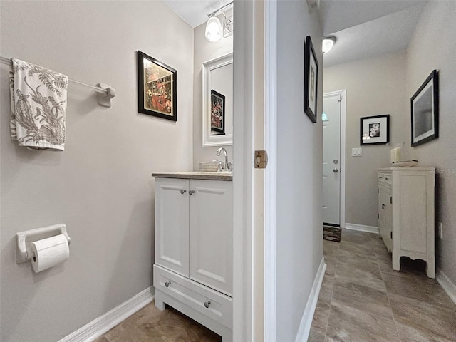 7508 Hollowell Dr, Tampa, FL 33615 - bathroom with vanity and baseboards