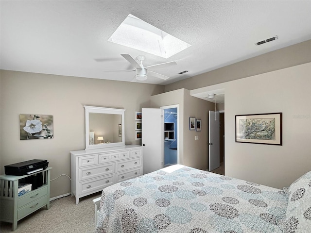 7508 Hollowell Dr, Tampa, FL 33615 - bedroom with visible vents, a skylight, ceiling fan, and light colored carpet