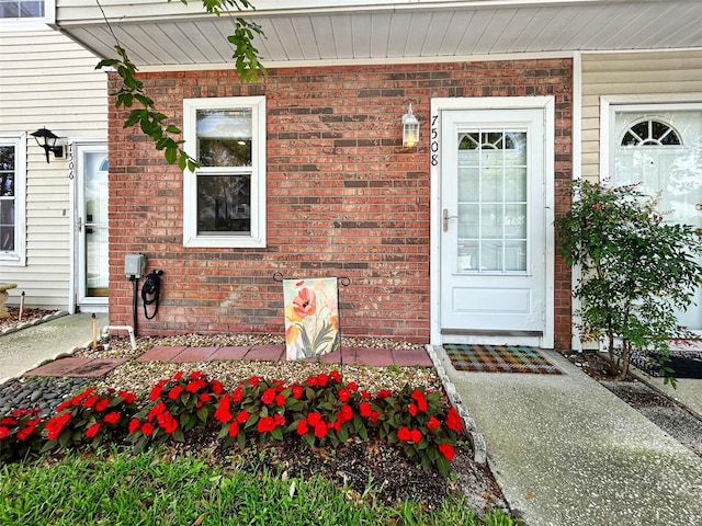 7508 Hollowell Dr, Tampa, FL 33615 - entrance to property featuring brick siding