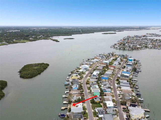 drone / aerial view with a residential view and a water view