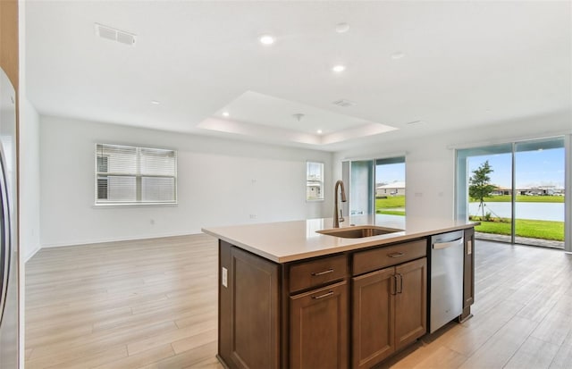 10317 Cross River Trl, Parrish, FL 34219 - kitchen with dishwasher, open floor plan, light wood-style floors, light countertops, and recessed lighting