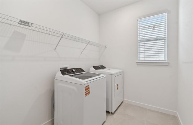 10317 Cross River Trl, Parrish, FL 34219 - laundry area featuring independent washer and dryer and light tile patterned floors