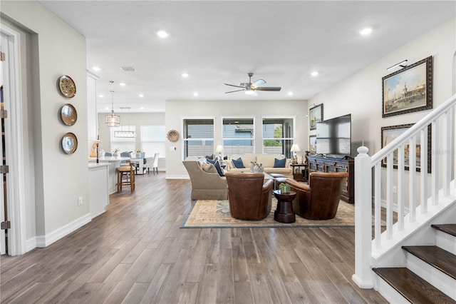 4365 Frontera Ln, Wesley Chapel, FL 33543 - living area with baseboards, recessed lighting, wood finished floors, stairs, and ceiling fan