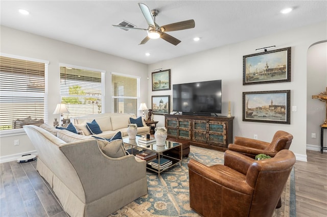 4365 Frontera Ln, Wesley Chapel, FL 33543 - living room with baseboards, a ceiling fan, wood finished floors, and visible vents