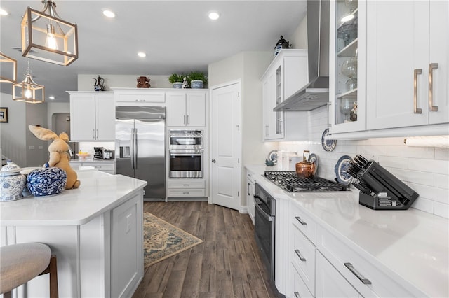 4365 Frontera Ln, Wesley Chapel, FL 33543 - kitchen with recessed lighting, wall chimney exhaust hood, white cabinetry, and stainless steel appliances