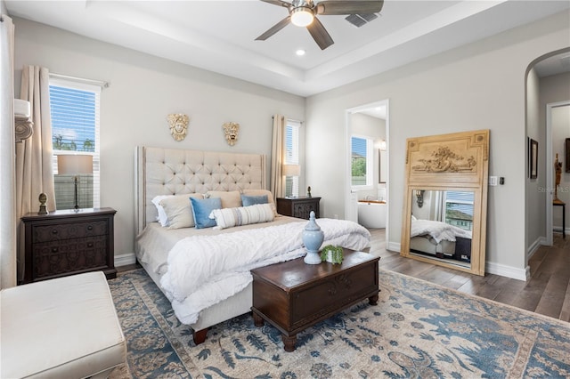 4365 Frontera Ln, Wesley Chapel, FL 33543 - bedroom with wood finished floors, arched walkways, a raised ceiling, baseboards, and recessed lighting