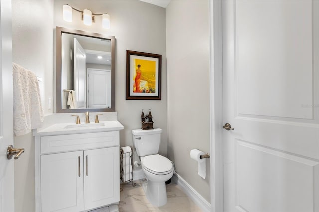 4365 Frontera Ln, Wesley Chapel, FL 33543 - bathroom featuring baseboards, marble finish floor, vanity, and toilet