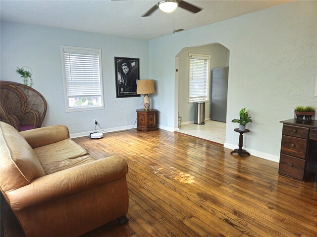 3545 7th Ave N, Saint Petersburg, FL 33713 - living room with ceiling fan, arched walkways, plenty of natural light, and hardwood / wood-style flooring