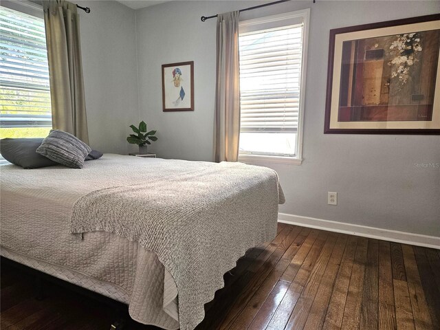 3545 7th Ave N, Saint Petersburg, FL 33713 - bedroom with dark wood-style flooring and baseboards