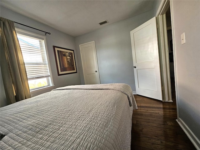 3545 7th Ave N, Saint Petersburg, FL 33713 - bedroom featuring dark wood-type flooring, visible vents, and baseboards