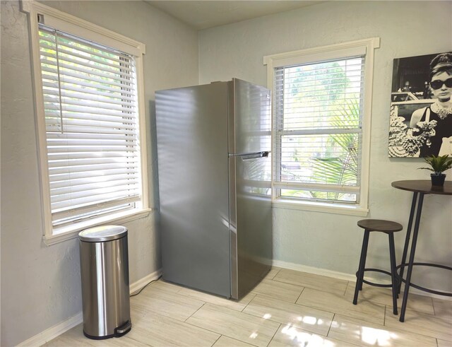 3545 7th Ave N, Saint Petersburg, FL 33713 - kitchen with freestanding refrigerator and baseboards