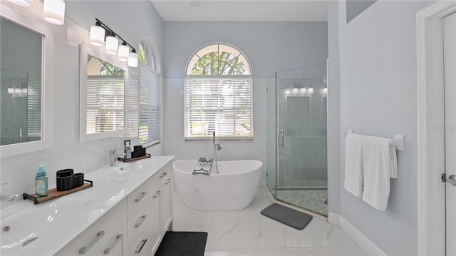 1084 Berkshire Ln, Tarpon Springs, FL 34688 - bathroom featuring marble finish flooring, healthy amount of natural light, a stall shower, and a freestanding bath