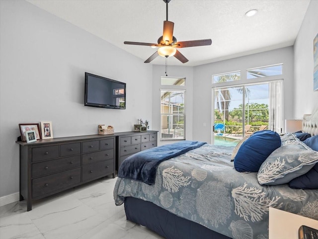 1084 Berkshire Ln, Tarpon Springs, FL 34688 - bedroom featuring light marble finish flooring, access to outside, baseboards, ceiling fan, and a textured ceiling