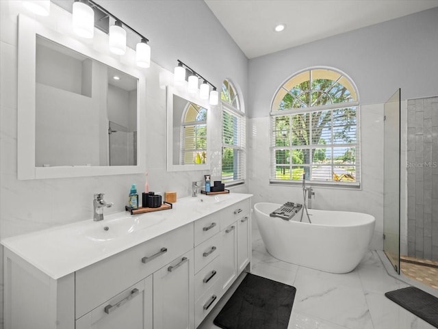 1084 Berkshire Ln, Tarpon Springs, FL 34688 - full bathroom featuring marble finish floors, a tile shower, healthy amount of natural light, a freestanding bath, and recessed lighting