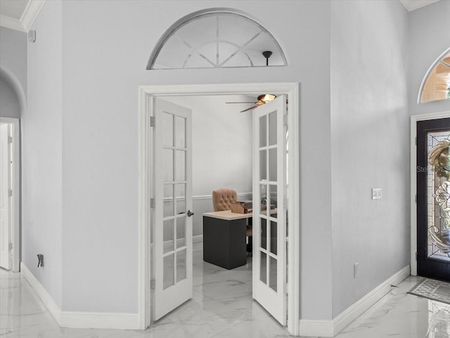 1084 Berkshire Ln, Tarpon Springs, FL 34688 - entryway featuring french doors, light marble finish flooring, baseboards, ornamental molding, and ceiling fan