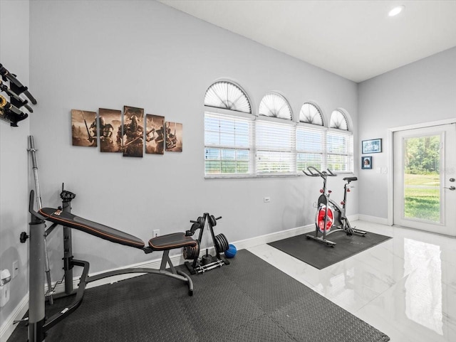 1084 Berkshire Ln, Tarpon Springs, FL 34688 - workout room with baseboards, marble finish floors, and recessed lighting