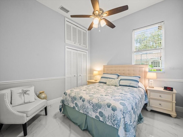 1084 Berkshire Ln, Tarpon Springs, FL 34688 - bedroom featuring marble look tiles, a closet, ceiling fan, and baseboards