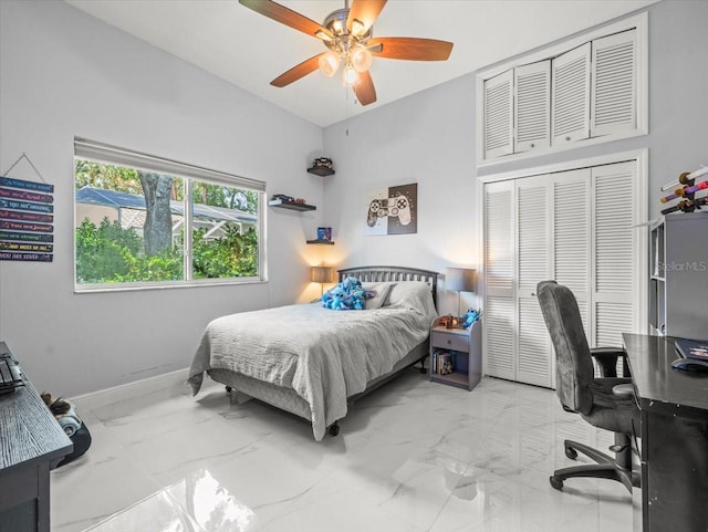 1084 Berkshire Ln, Tarpon Springs, FL 34688 - bedroom featuring marble finish floors, an office area, a closet, baseboards, and ceiling fan