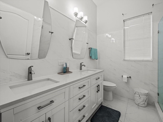 1084 Berkshire Ln, Tarpon Springs, FL 34688 - bathroom featuring tile walls, marble finish floors, toilet, a shower with shower door, and double vanity