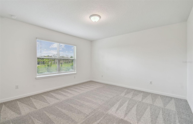 10414 Cross River Trl, Parrish, FL 34219 - spare room with carpet flooring and a smoke detector