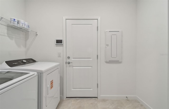 10414 Cross River Trl, Parrish, FL 34219 - laundry room featuring washing machine and clothes dryer, electric panel, and light tile patterned floors