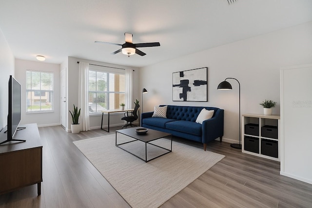 10906 Keys Gate Dr, Riverview, FL 33579 - living room featuring a ceiling fan and wood finished floors