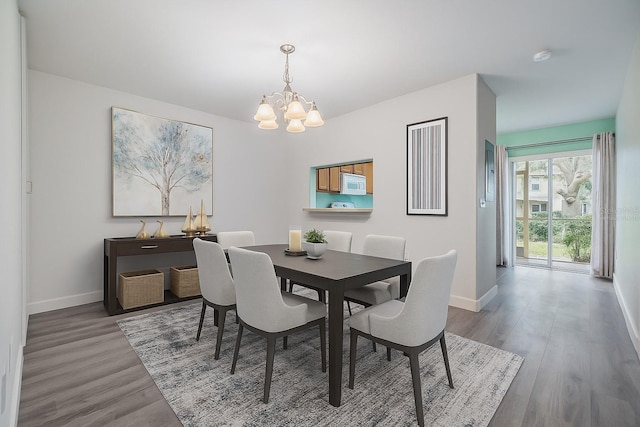 10906 Keys Gate Dr, Riverview, FL 33579 - dining room with a chandelier and wood finished floors