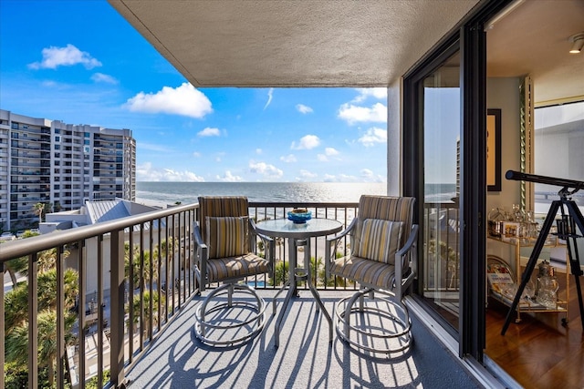 balcony featuring a water view