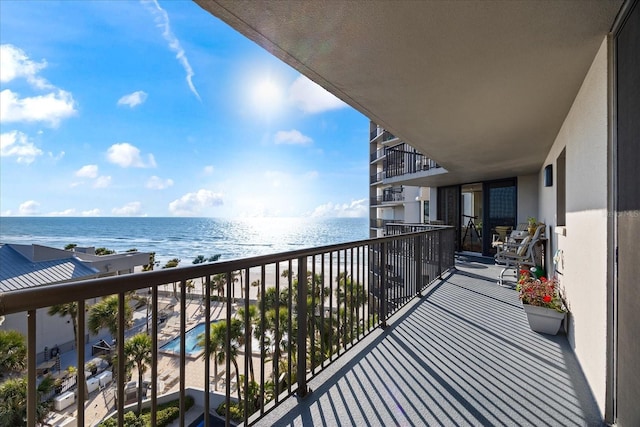 balcony featuring a water view