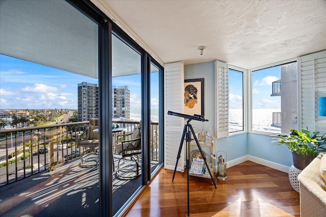 interior space featuring a water view and a view of city