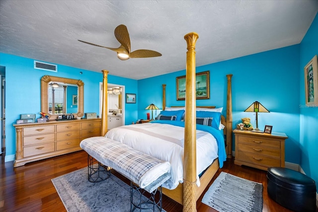 bedroom featuring visible vents, ceiling fan, and wood finished floors