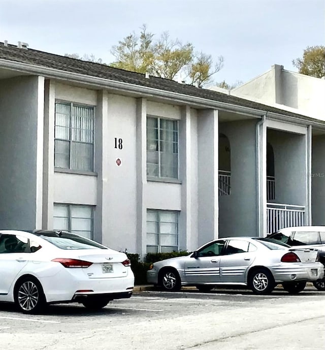 2625 State Road 590 Unit 1822, Clearwater, FL 33759 - view of front of property featuring uncovered parking and stucco siding