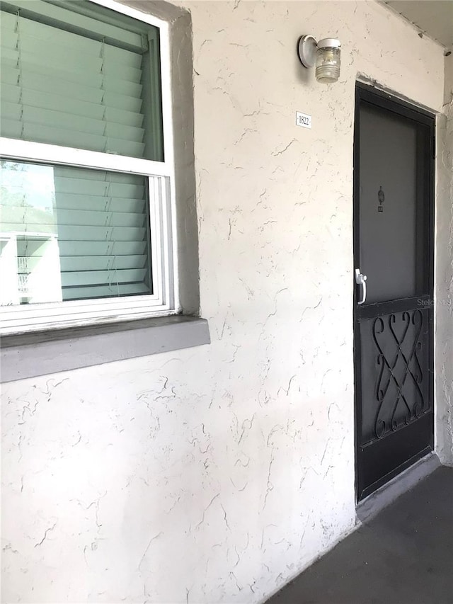2625 State Road 590 Unit 1822, Clearwater, FL 33759 - view of exterior entry with stucco siding