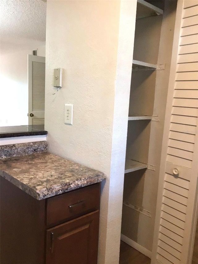 2625 State Road 590 Unit 1822, Clearwater, FL 33759 - bathroom with a textured wall, vanity, and a textured ceiling