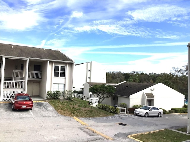 2625 State Road 590 Unit 1822, Clearwater, FL 33759 - view of building exterior featuring uncovered parking