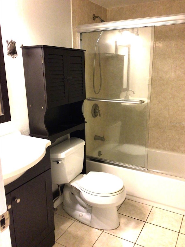 2625 State Road 590 Unit 1822, Clearwater, FL 33759 - bathroom featuring shower / bath combination with glass door, tile patterned floors, vanity, and toilet