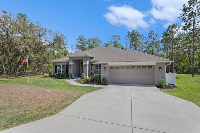 view of front of home featuring driveway, stucco siding, an attached garage, and a front lawn