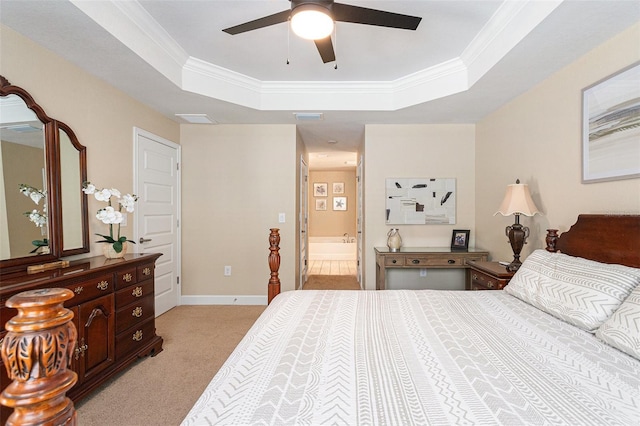 bedroom with baseboards, light carpet, crown molding, visible vents, and a raised ceiling